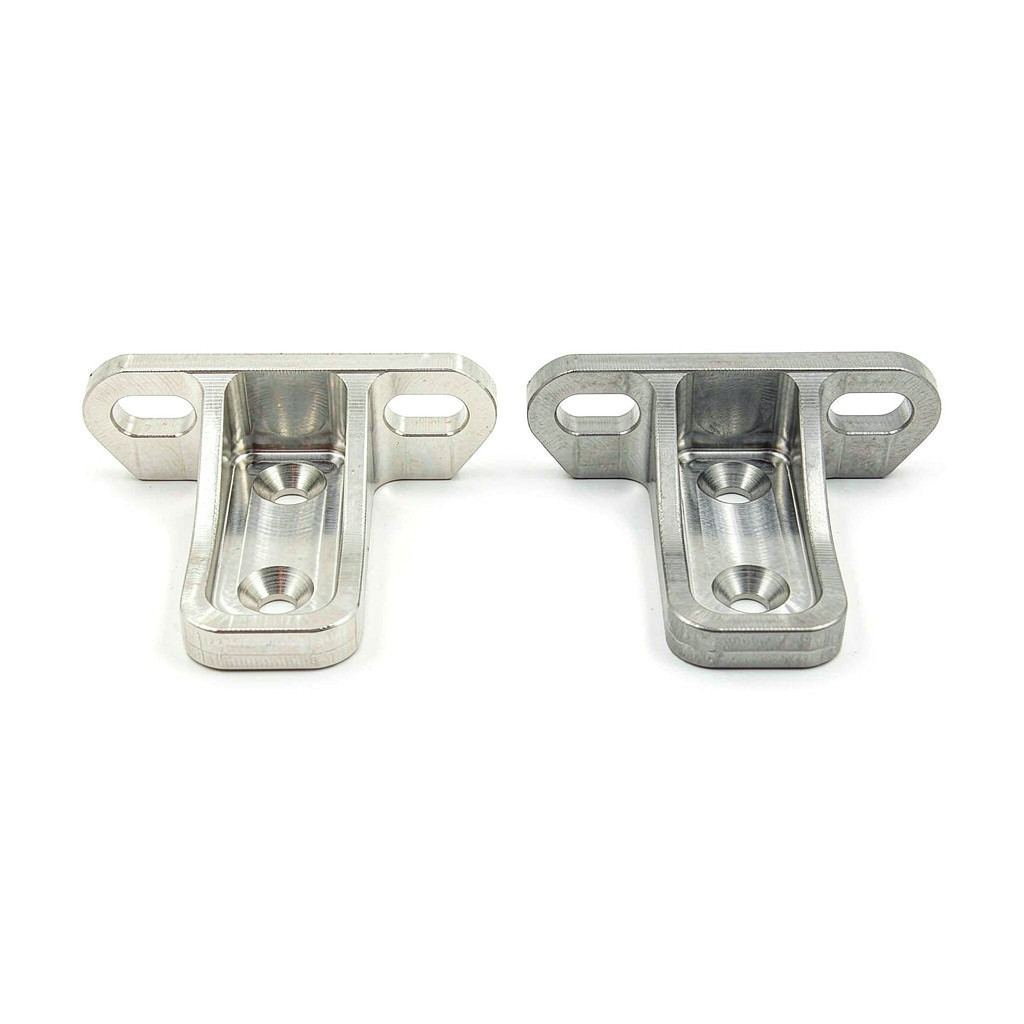 A precision CNC machined bracket shown in 6061 and 7075 aluminum side by side