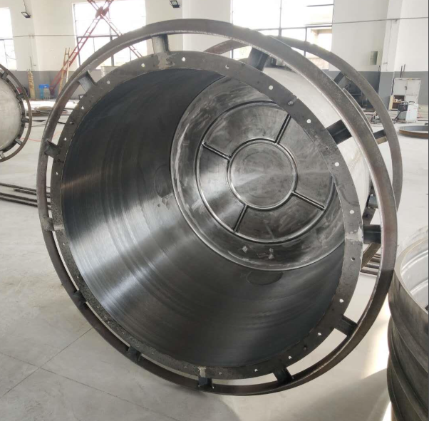 Open aluminum rotomolding mold with a molded part, showing mold half and cavity