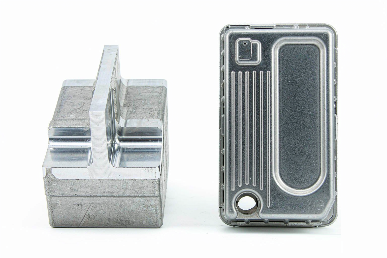 CNC machined aluminum part compared with a die-cast aluminum housing