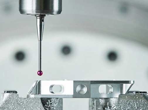 T1 molded sample part under coordinate measuring machine with caliper