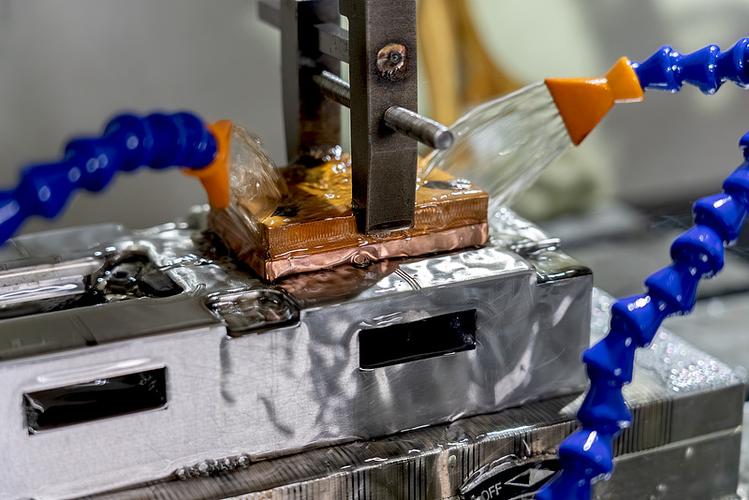 Wire EDM machining a precision metal punch on the shop floor