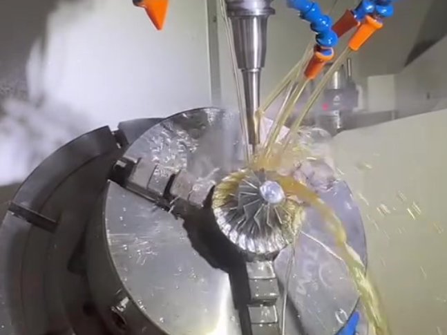 Simultaneous 5-axis machining of a curved impeller blade in Inconel 718 with coolant