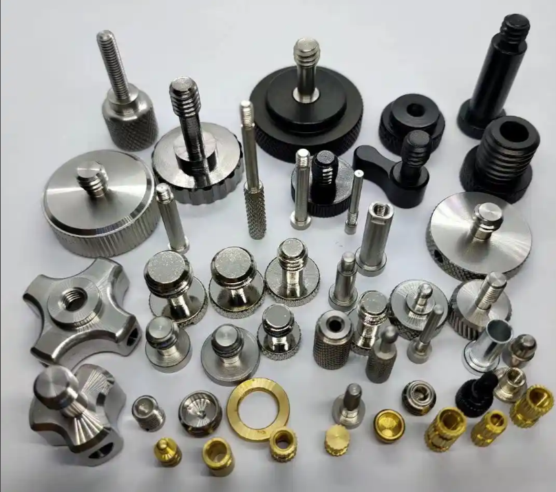 A row of finished alloy steel machined components of different shapes on a steel inspection bench with calipers nearby