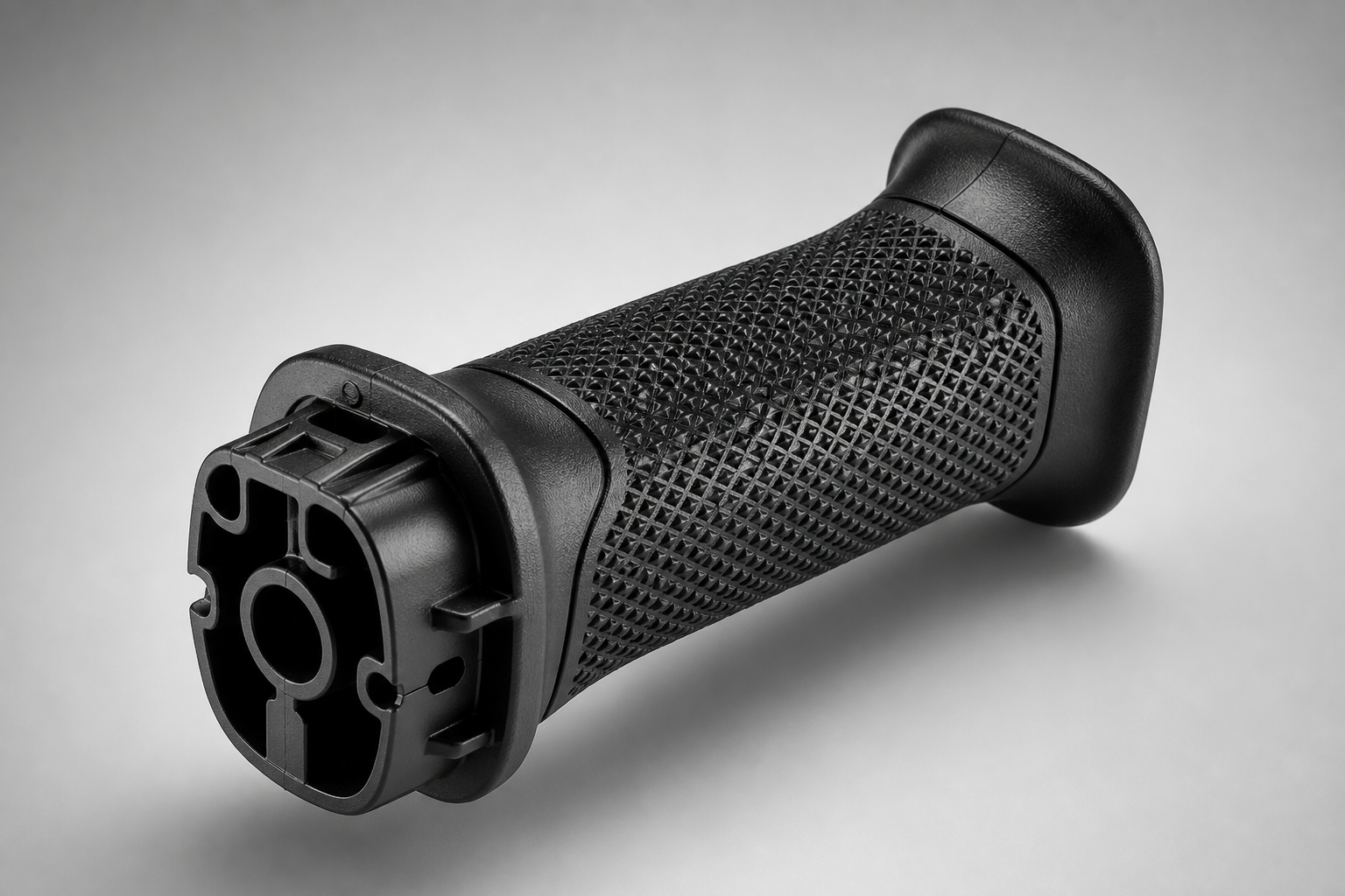 TPE overmolded power tool handle — Shore 60A textured grip on PA6-GF30 nylon substrate