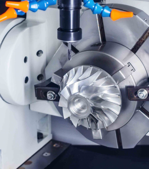 CNC vertical machining center cutting a precision aluminum prototype part in a workshop