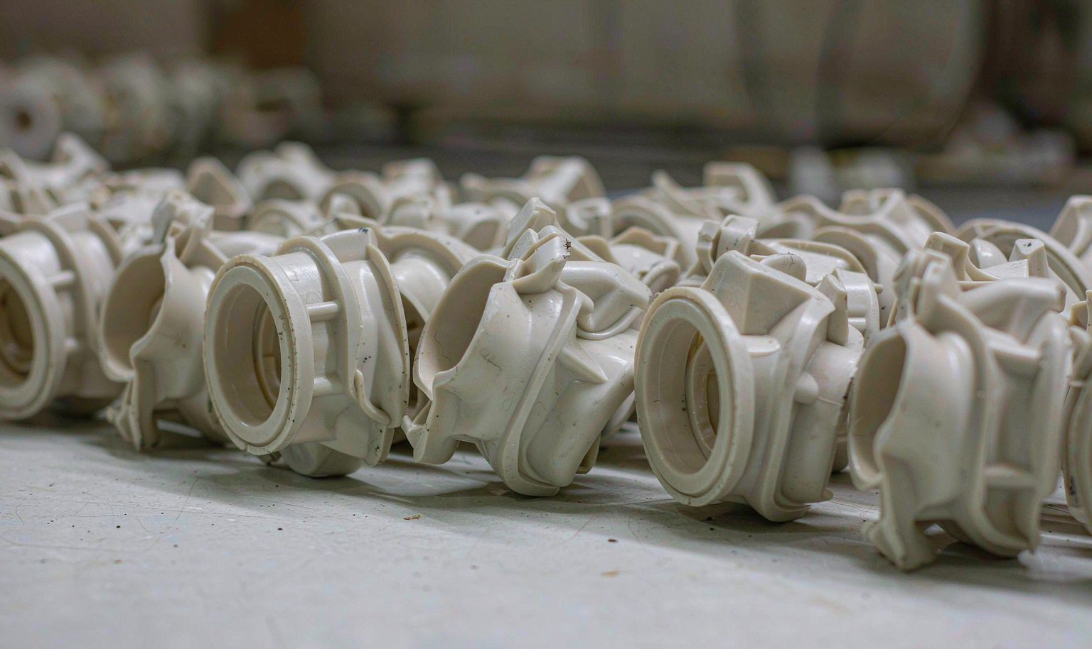 Injection-molded nylon components arranged on the bench after demolding
