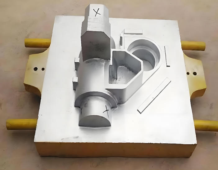 Close-up of a machined steel die casting mold cavity showing cooling channels and parting line
