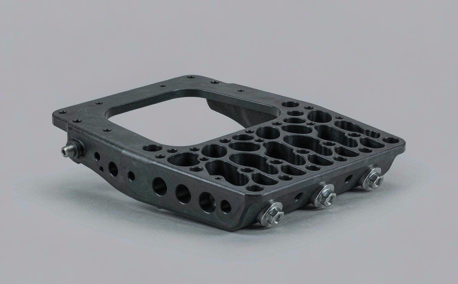Topology-optimized black nylon aerospace bracket with organic lattice structures
