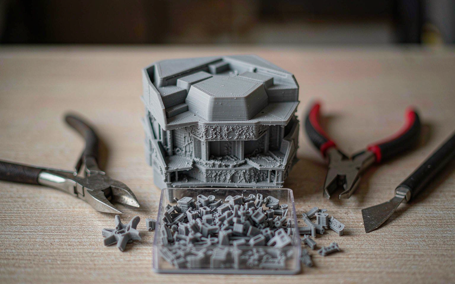 Support removal tools and a 3D printed polymer part during post-processing