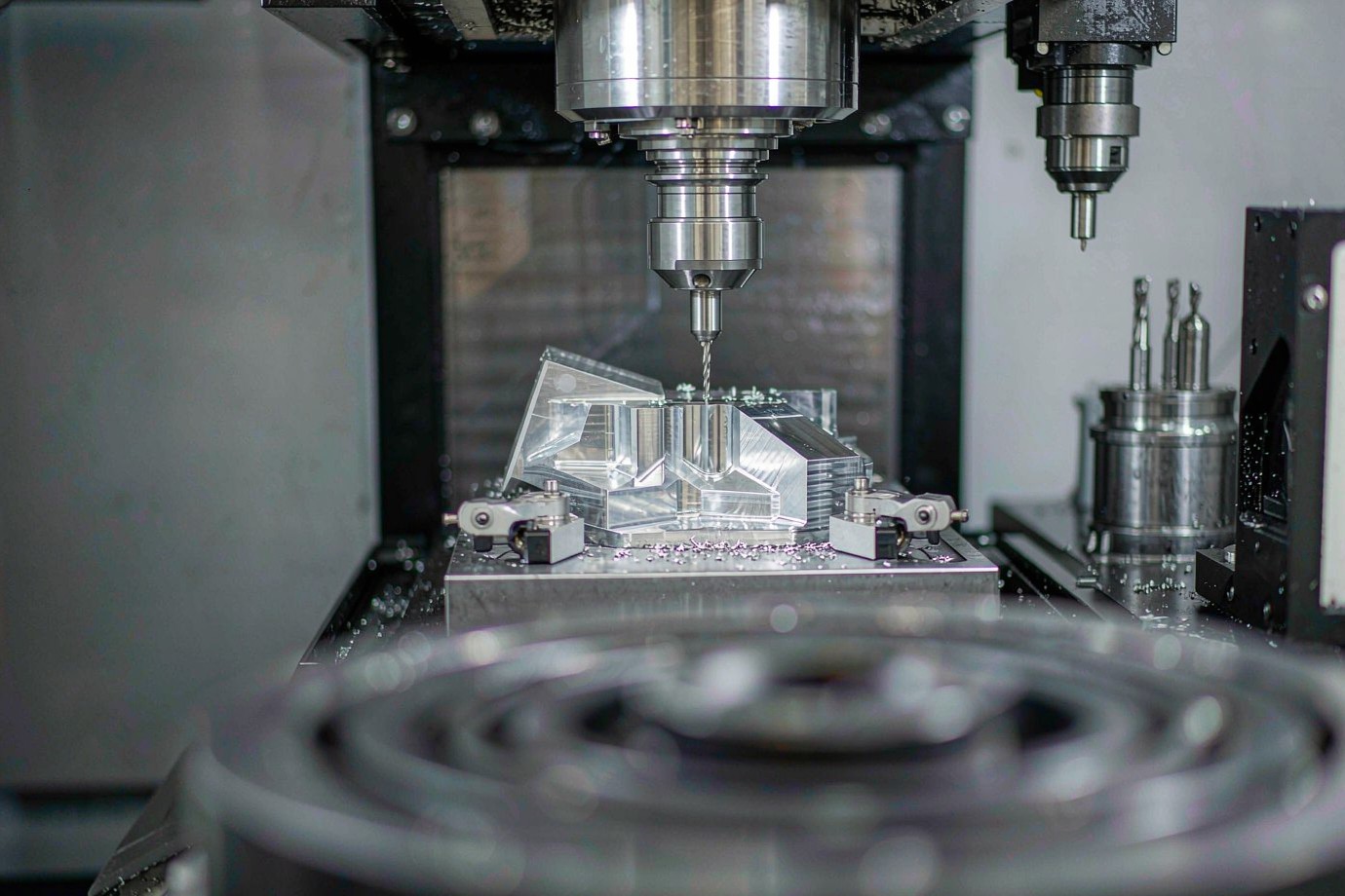 CNC machining workshop with machined metal parts on a milling centre