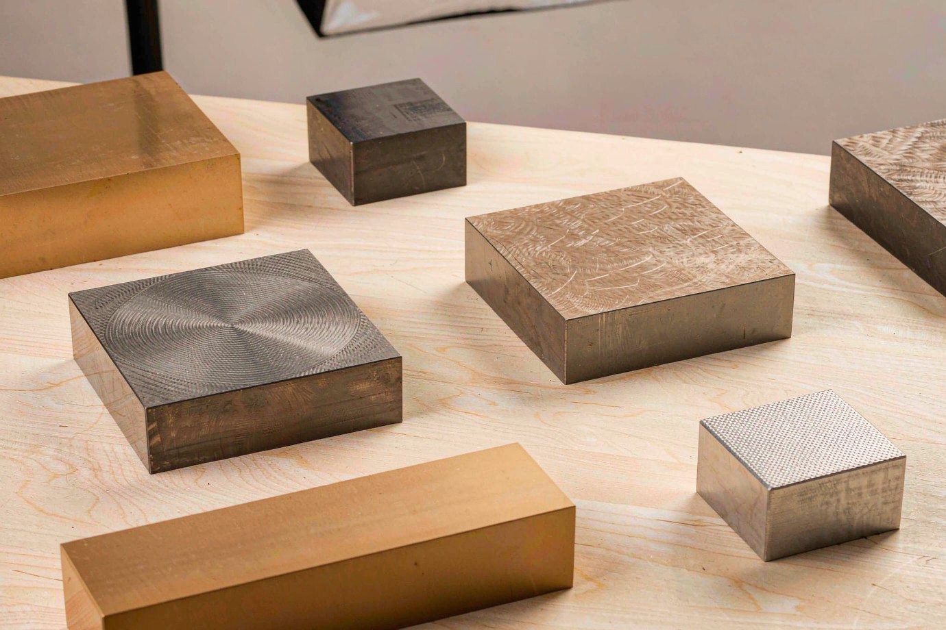 CNC material samples including aluminium, stainless steel and titanium stock