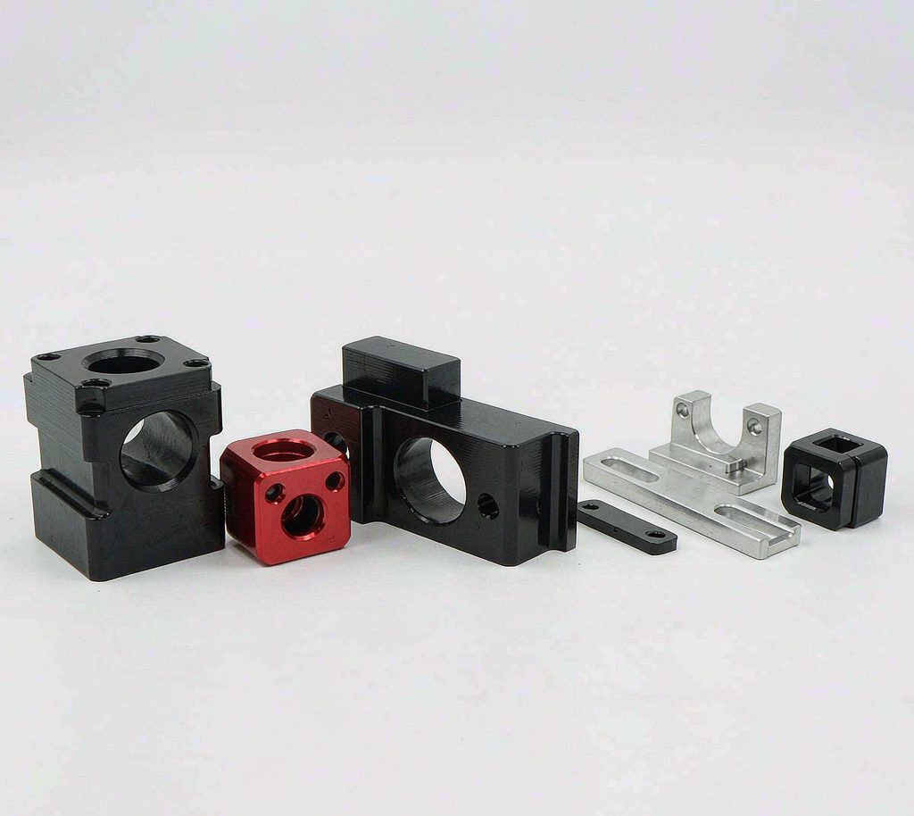 Row of black and colored anodized aluminum CNC machined e-bike components