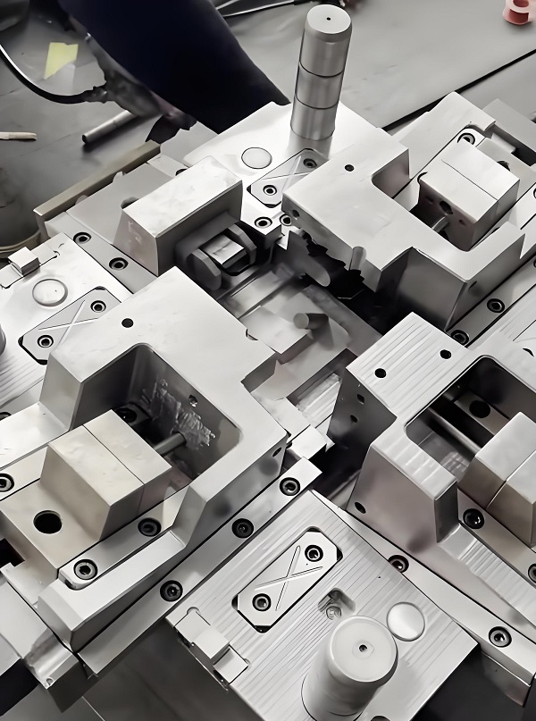 First-article molded parts inspected after a slide core mold trial