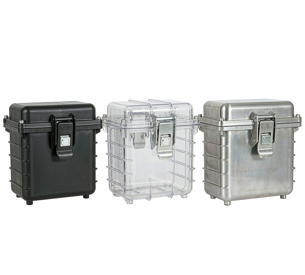 Matte black plastic, clear polycarbonate and brushed stainless steel junction box housings shown side by side