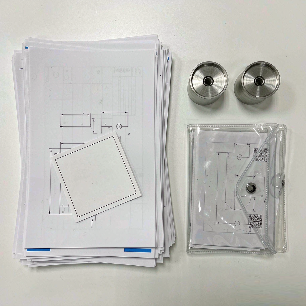 Flat lay of inspection reports and certificates with finished medical components