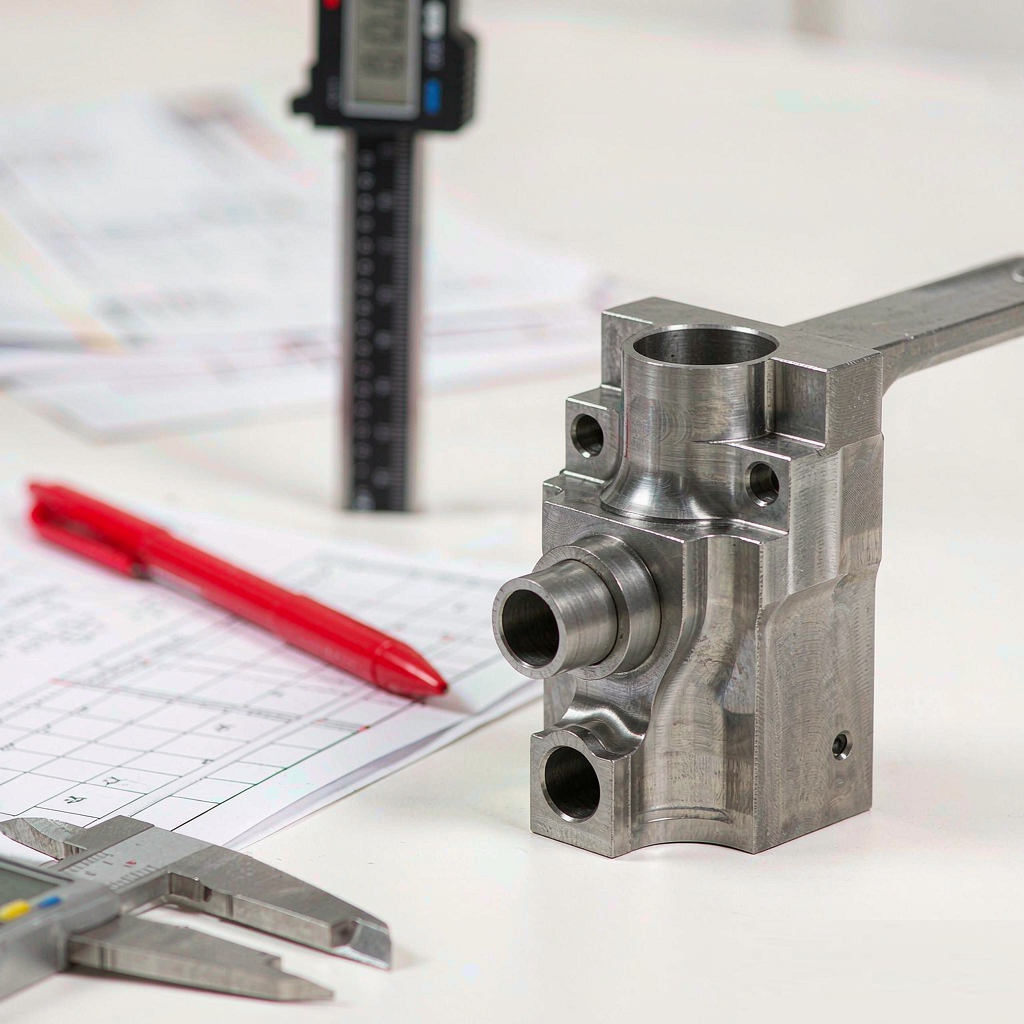 First article inspection setup with a medical component, caliper and inspection report