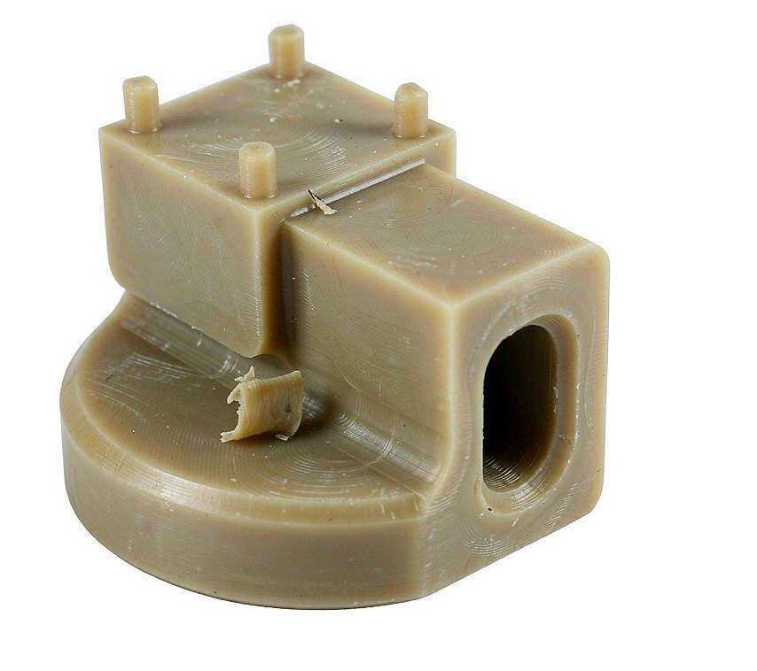 Close-up of CNC machining of a PEEK component on a milling machine