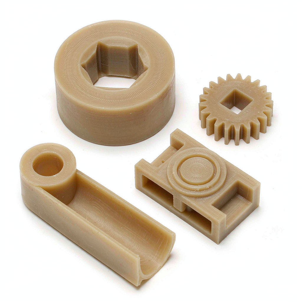 Collection of machined PEEK components including insulators, bushings, and fixtures