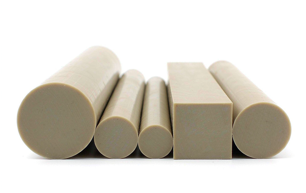 PEEK stock forms: extruded rods and plates ready for CNC machining