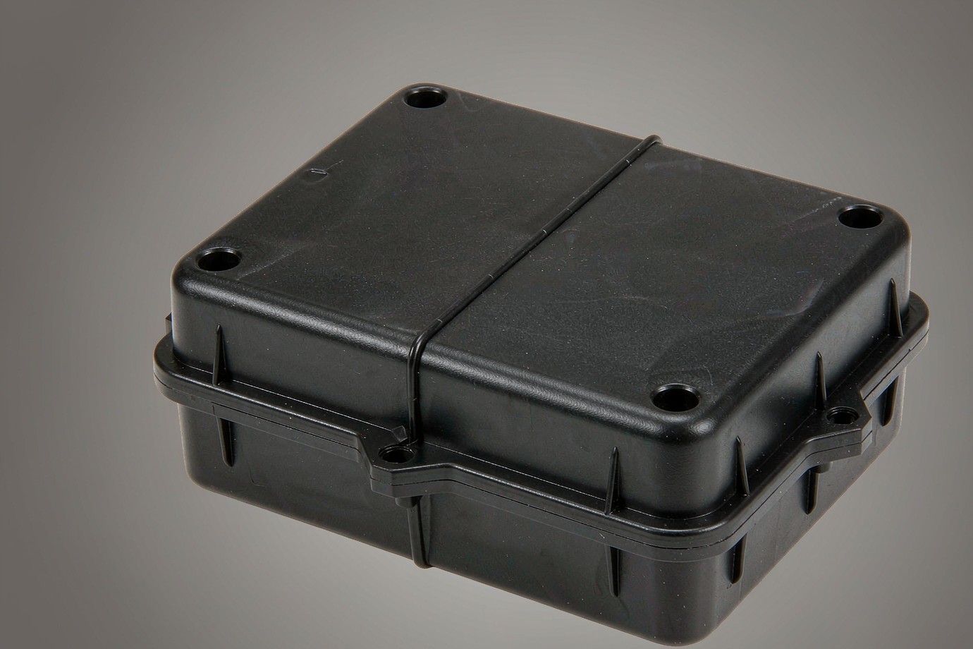 Black ABS plastic electronic enclosure housing with a visible moulded parting line