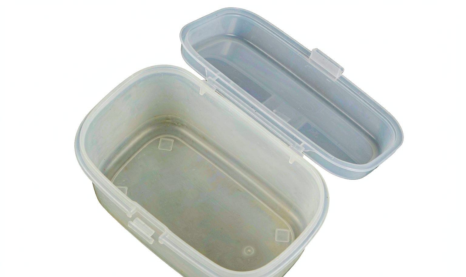Polypropylene container with an integral living hinge lid opened flat, showing the thin flexible web