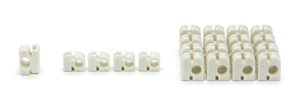 Progression of CNC machined prototype parts from a single sample to a small batch to a row of finished pre-production parts