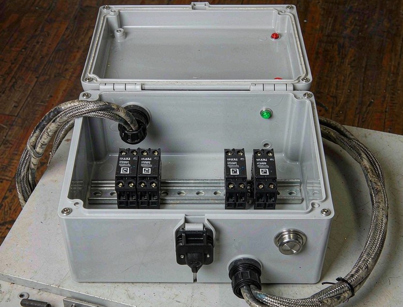 Custom control box with internal DIN rail and mounted terminal blocks