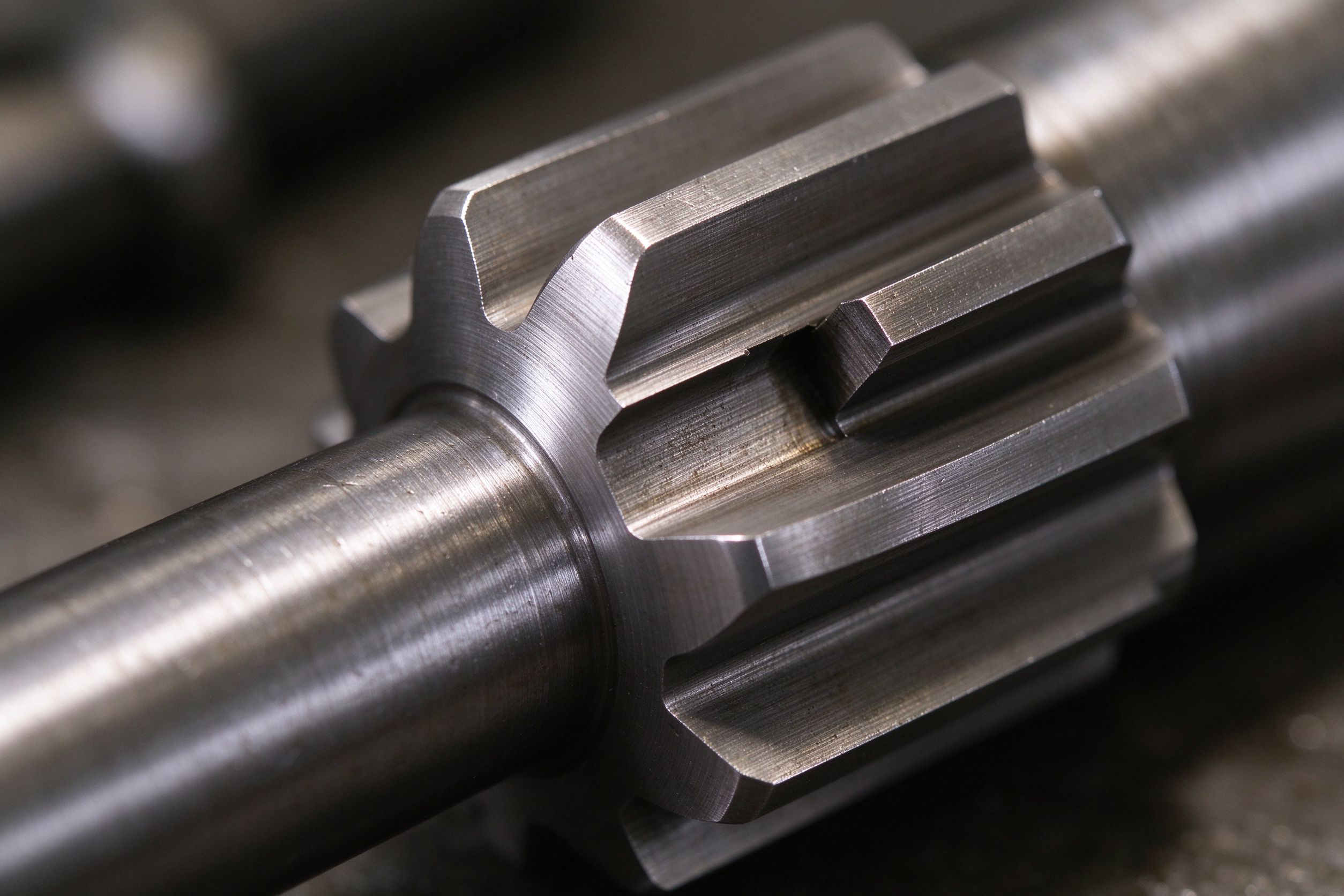 Close-up of precision machined steel spline end on an automotive shaft component