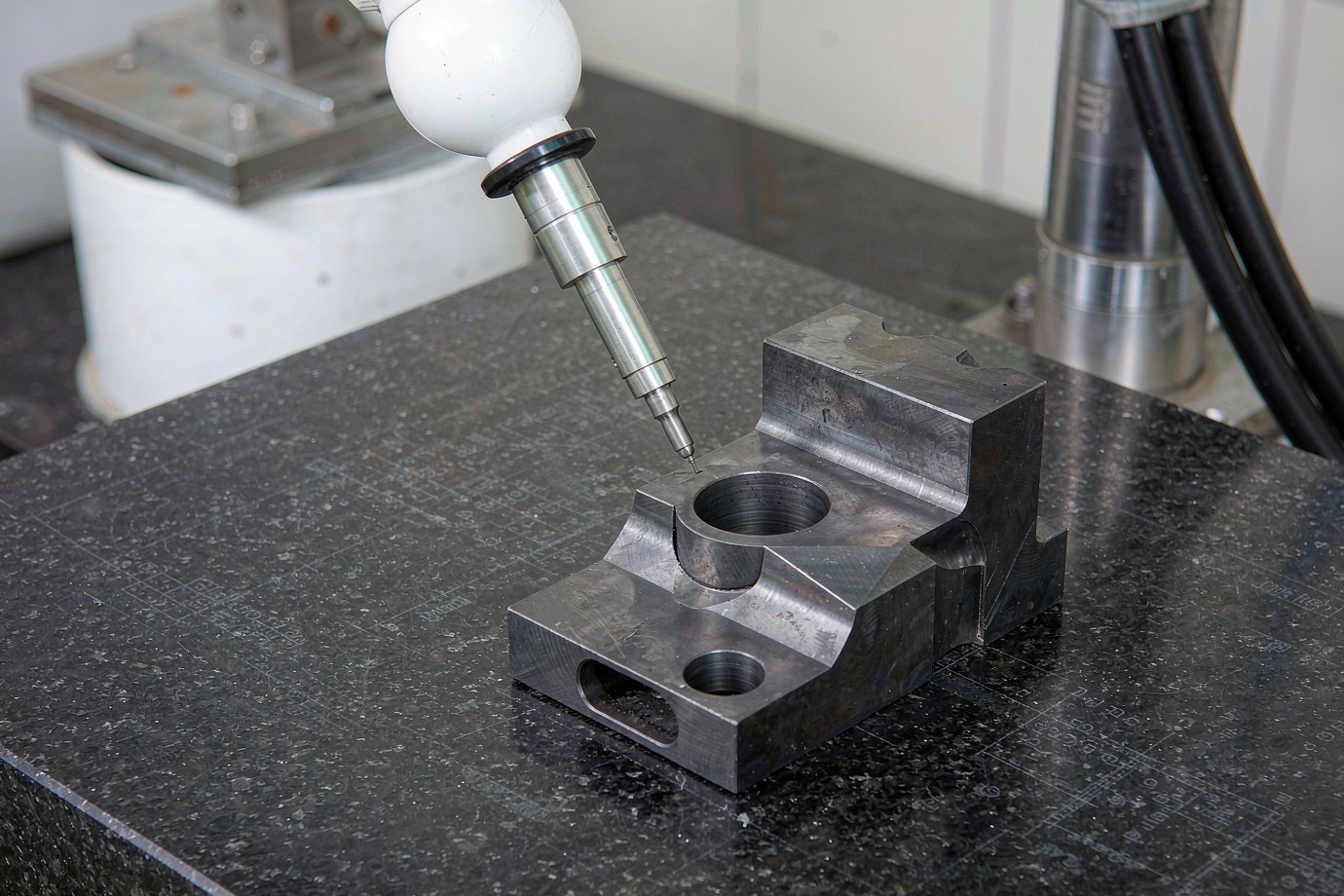 Zeiss Prismo CMM probing a Ti-6Al-4V machined part during inspection