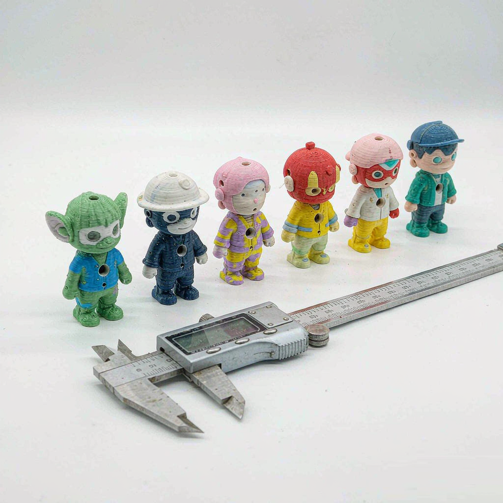 Quality inspection of custom 3D printed toy figures before packaging
