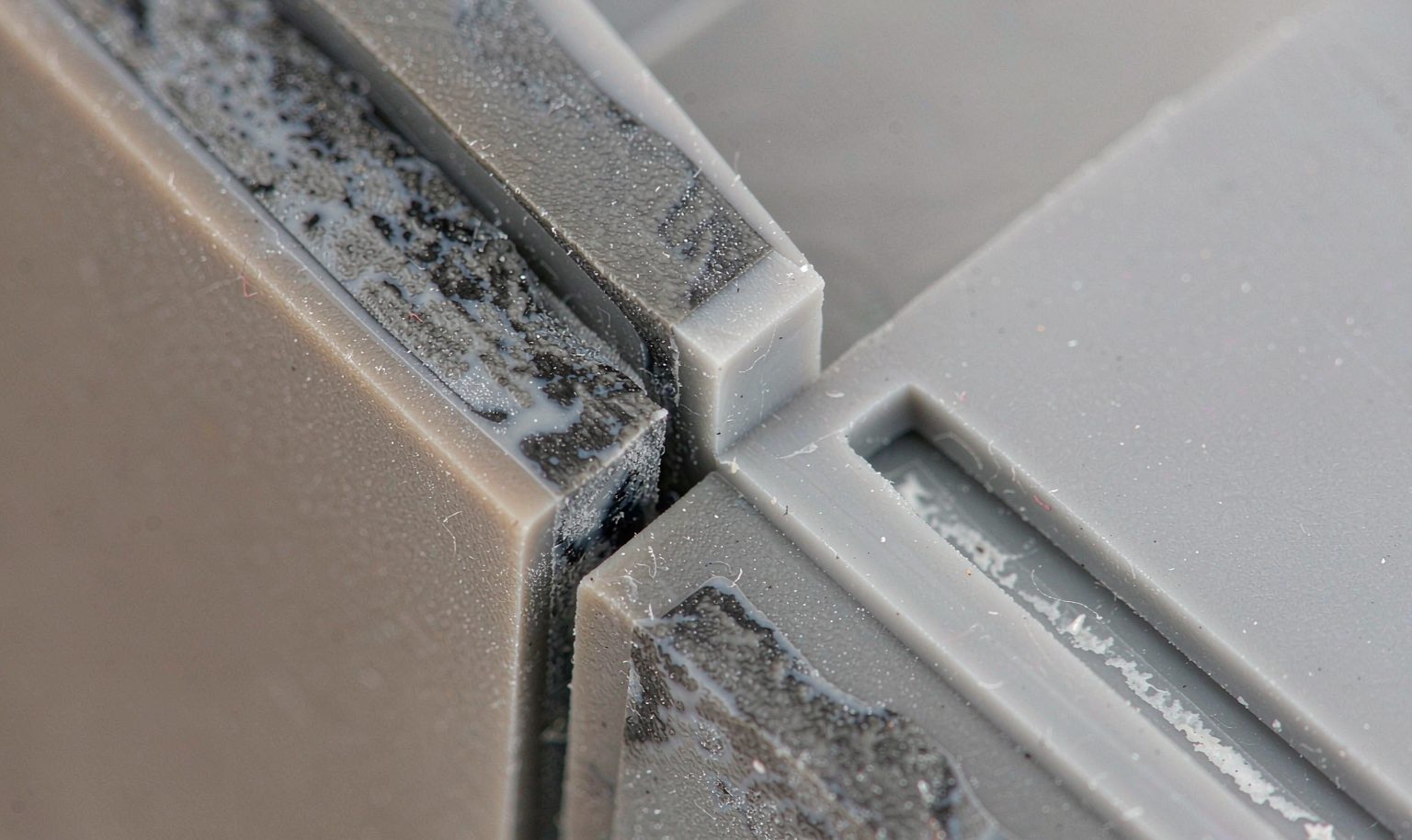 Close-up of the bond interface between two materials on a two-shot molded part