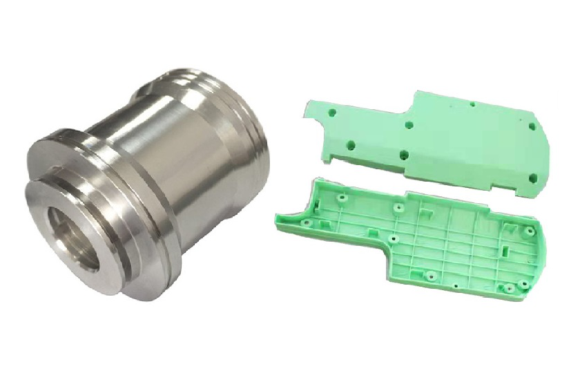 Machined aluminium component beside a sprue of identical injection moulded plastic parts