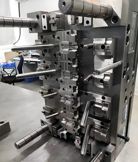 Injection moulding machine clamping unit and mould area during production at Xiamen Goldcattle