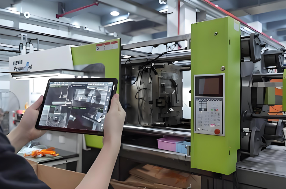 Injection mould being lifted into an injection moulding machine with a hoist at Xiamen Goldcattle