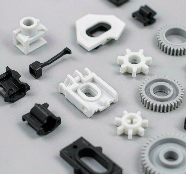 Assortment of precision injection moulded plastic components produced at Xiamen Goldcattle