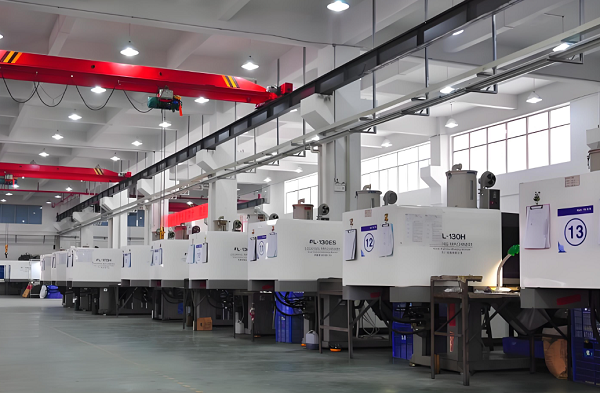 Aisle of injection moulding machines in the Xiamen Goldcattle moulding workshop