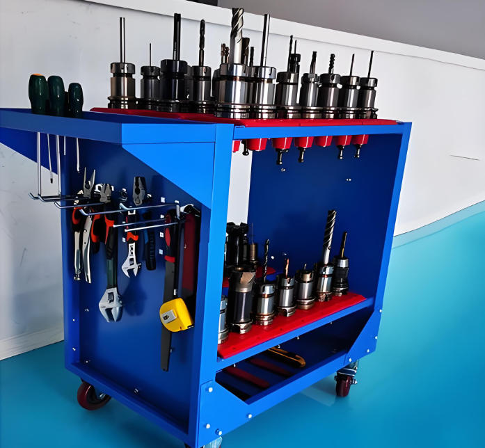 Array of CNC cutting tools and tool holders of various diameters on a workbench
