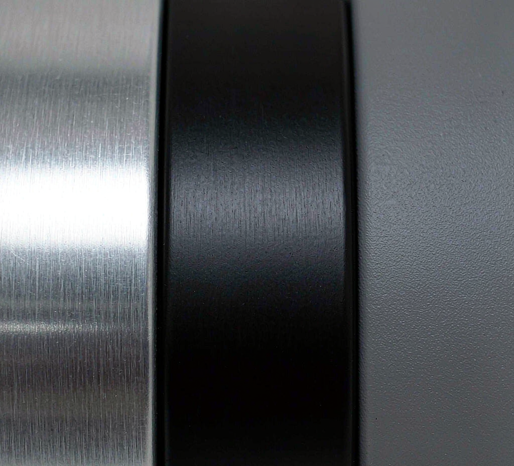 Macro view of aluminum surfaces showing natural, anodized and powder-coated finishes
