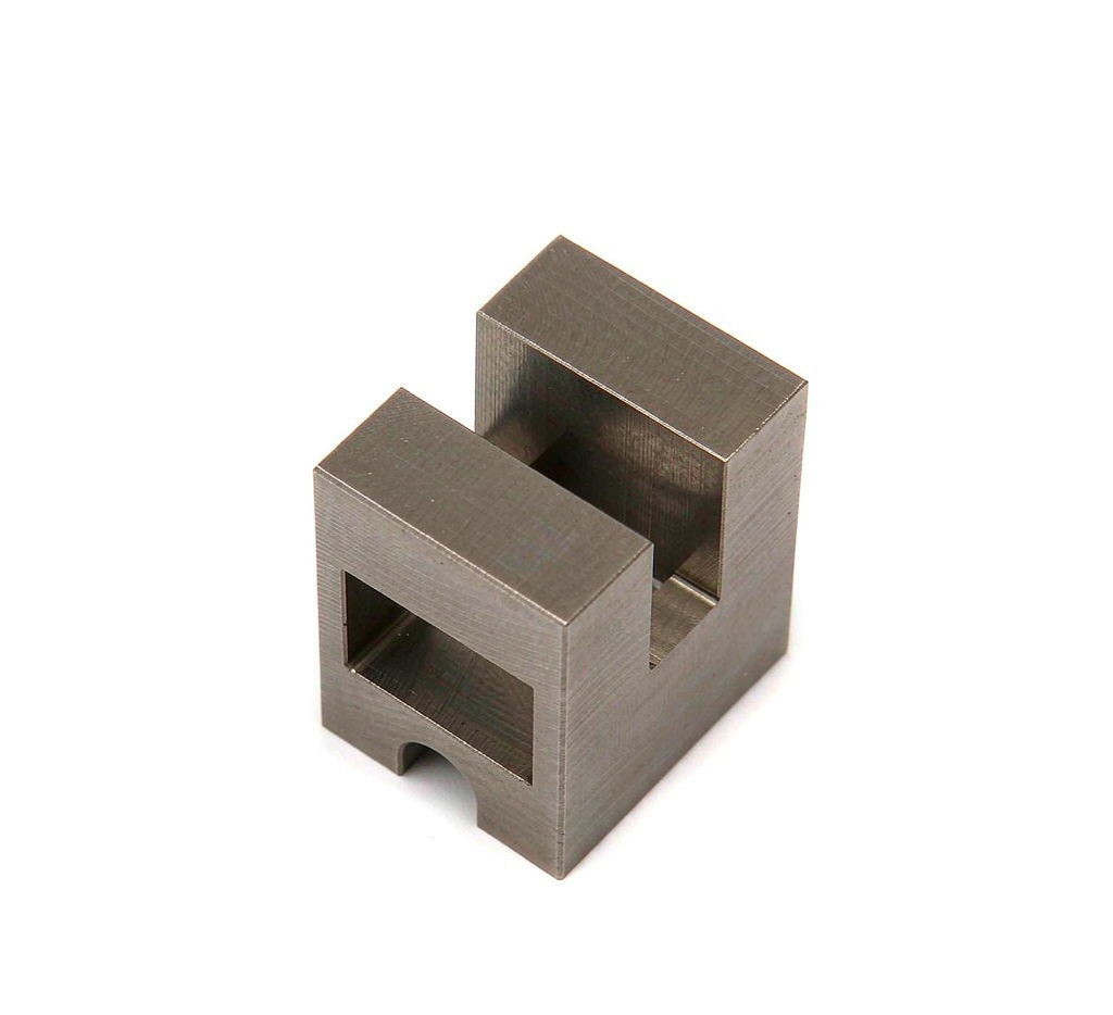 Close-up of a precision machined Ti-6Al-4V component with brushed metallic gray surface