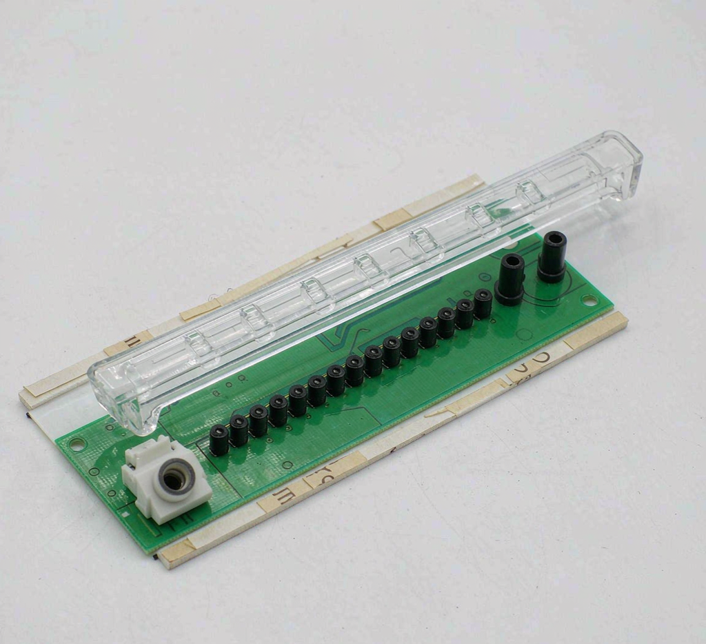 Custom LED tail light sub-assembly: PCB with surface-mount LEDs and a clear light guide