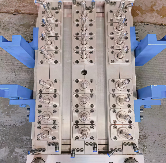 Multi-cavity injection mold steel tool with hot runner manifold
