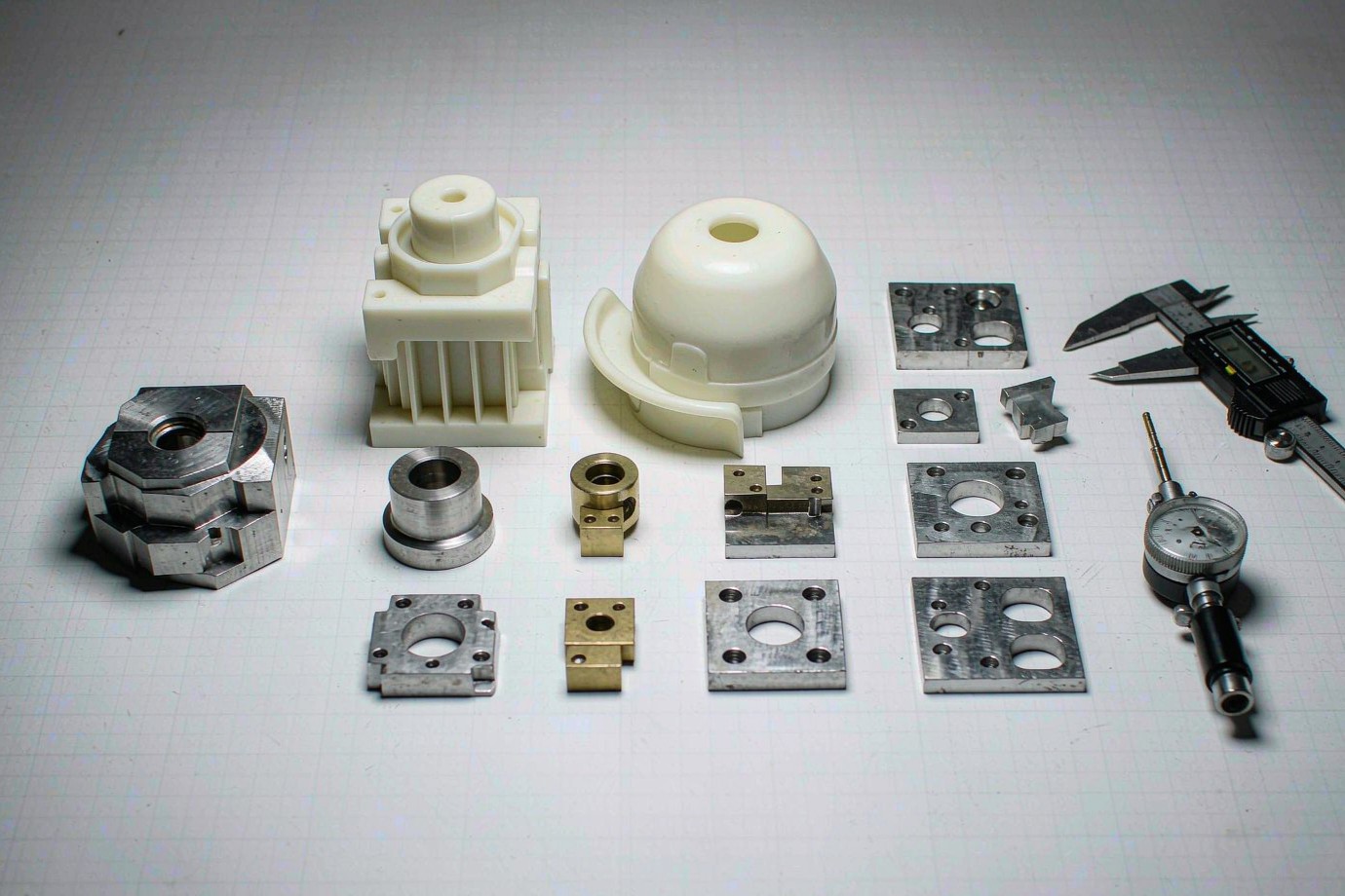 Illustrative: sample machined metal and molded plastic parts