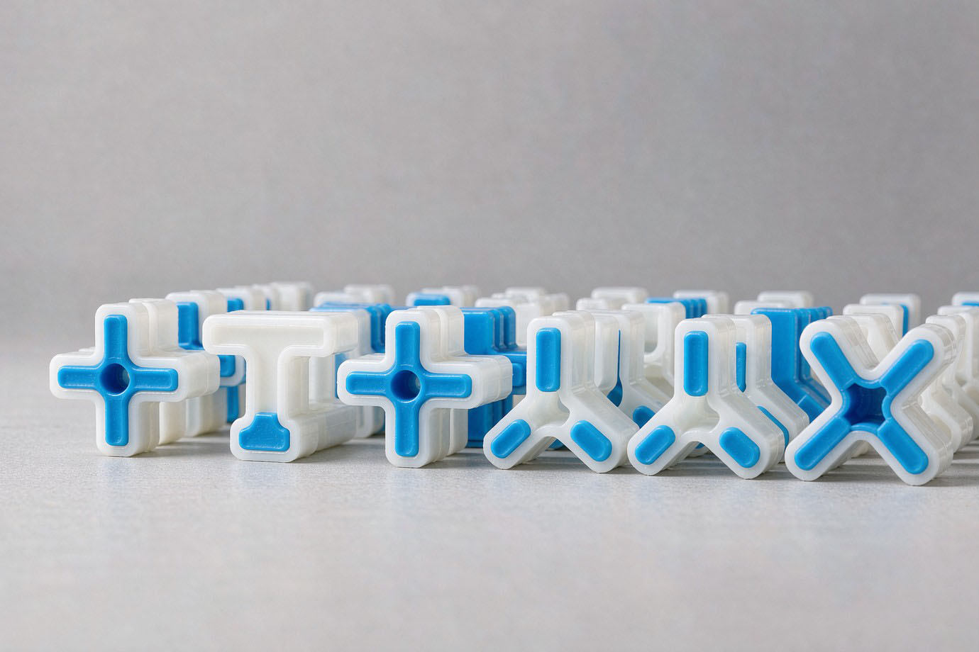 Illustrative — custom plastic tile spacers in cross, T and Y shapes