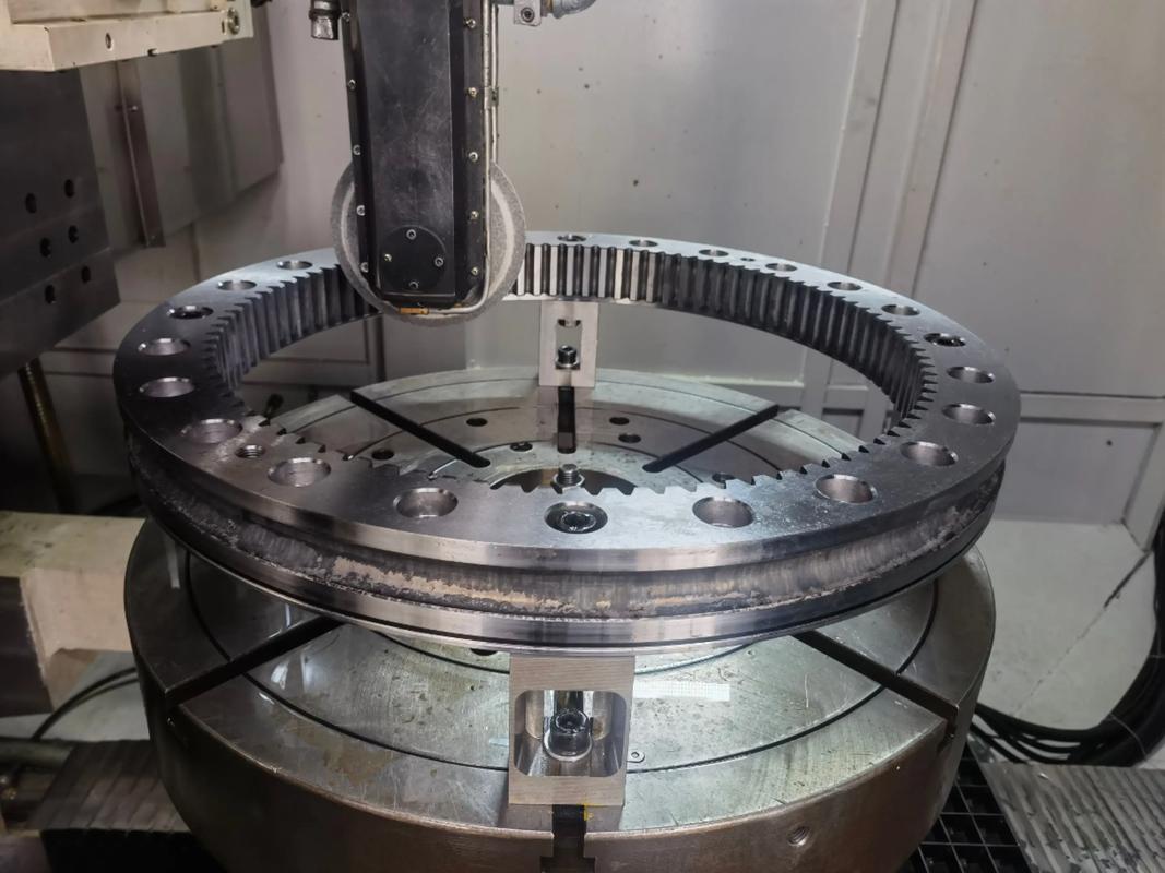 Gear hobbing and grinding machining process at Goldcattle showing hob engaged on gear blank and grinding machine finishing hardened teeth