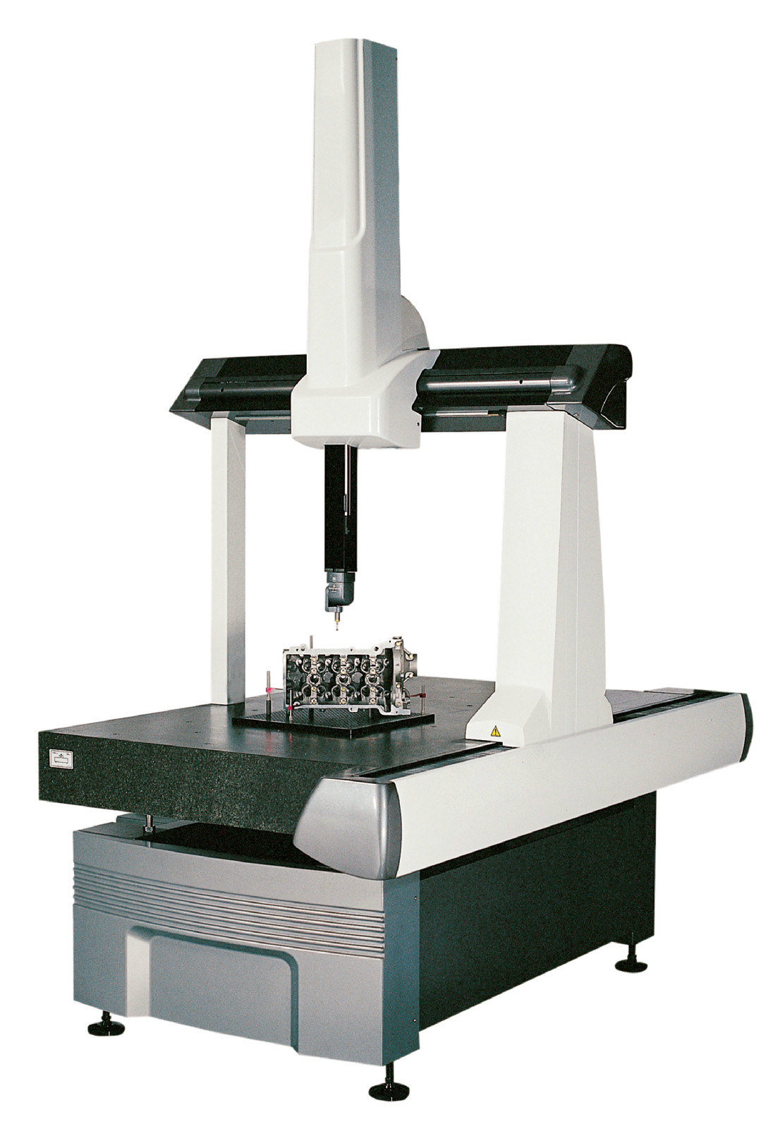 Quality control technician using CMM equipment