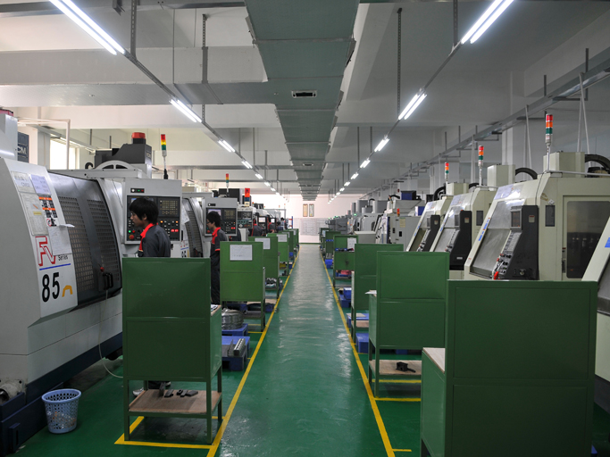 Xiamen Goldcattle CNC machining facility interior showing multiple machines