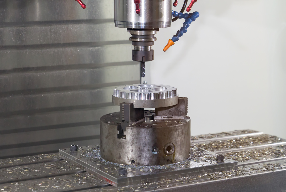CNC milling machine working on a metal part