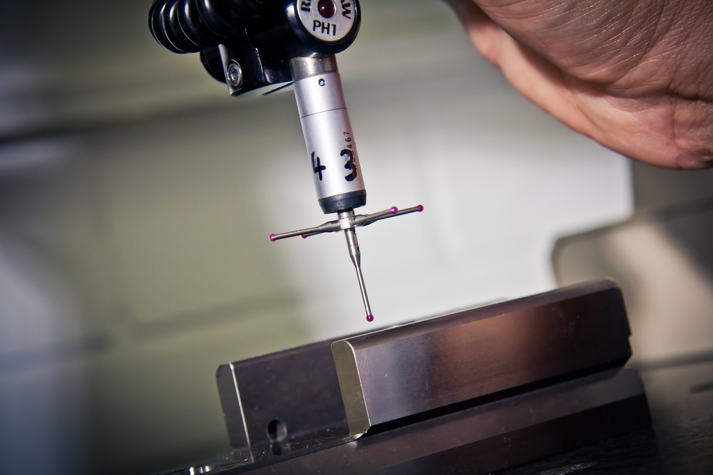 CNC machine precision measurement during automotive part manufacturing