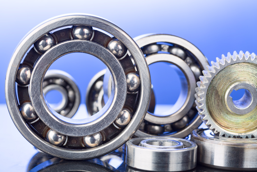MC Nylon Bearings and Gears on Blue Background