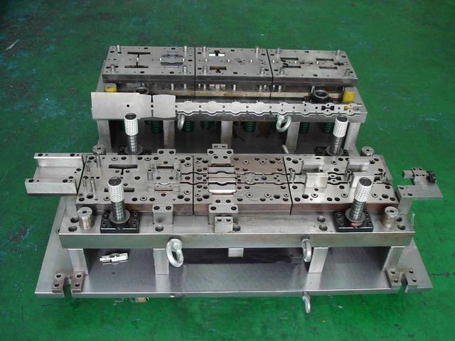 Progressive stamping production machine